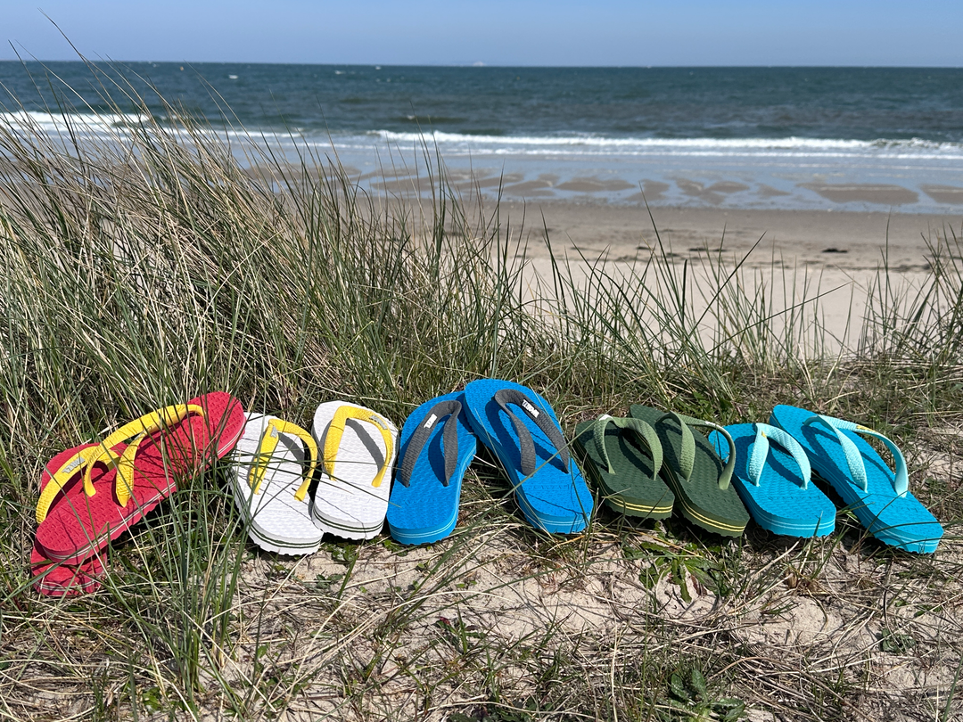 selection pf Worzl flip flops on the dunes by the sea.